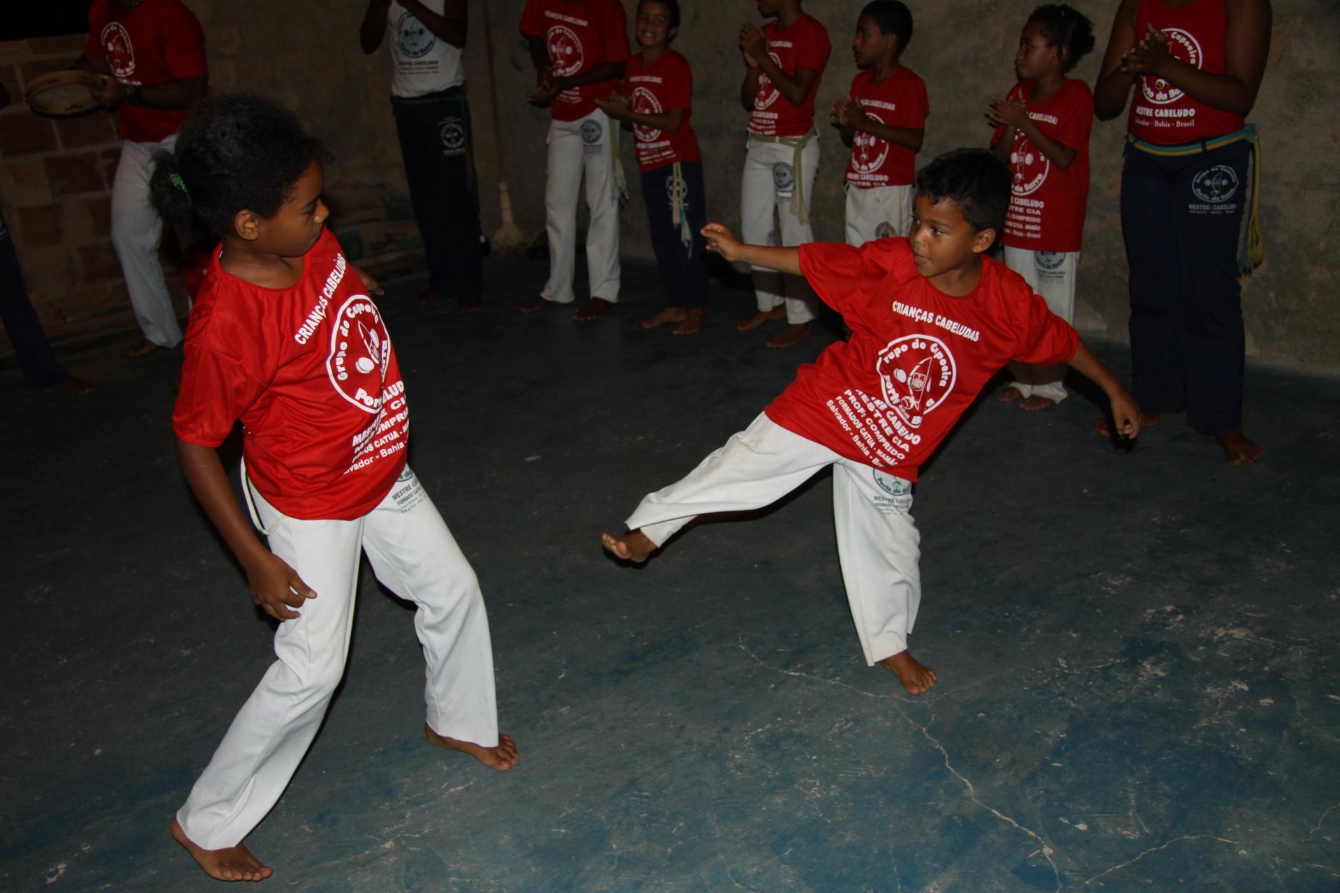 Two children fight in a Capoeira Roda in Imbassai