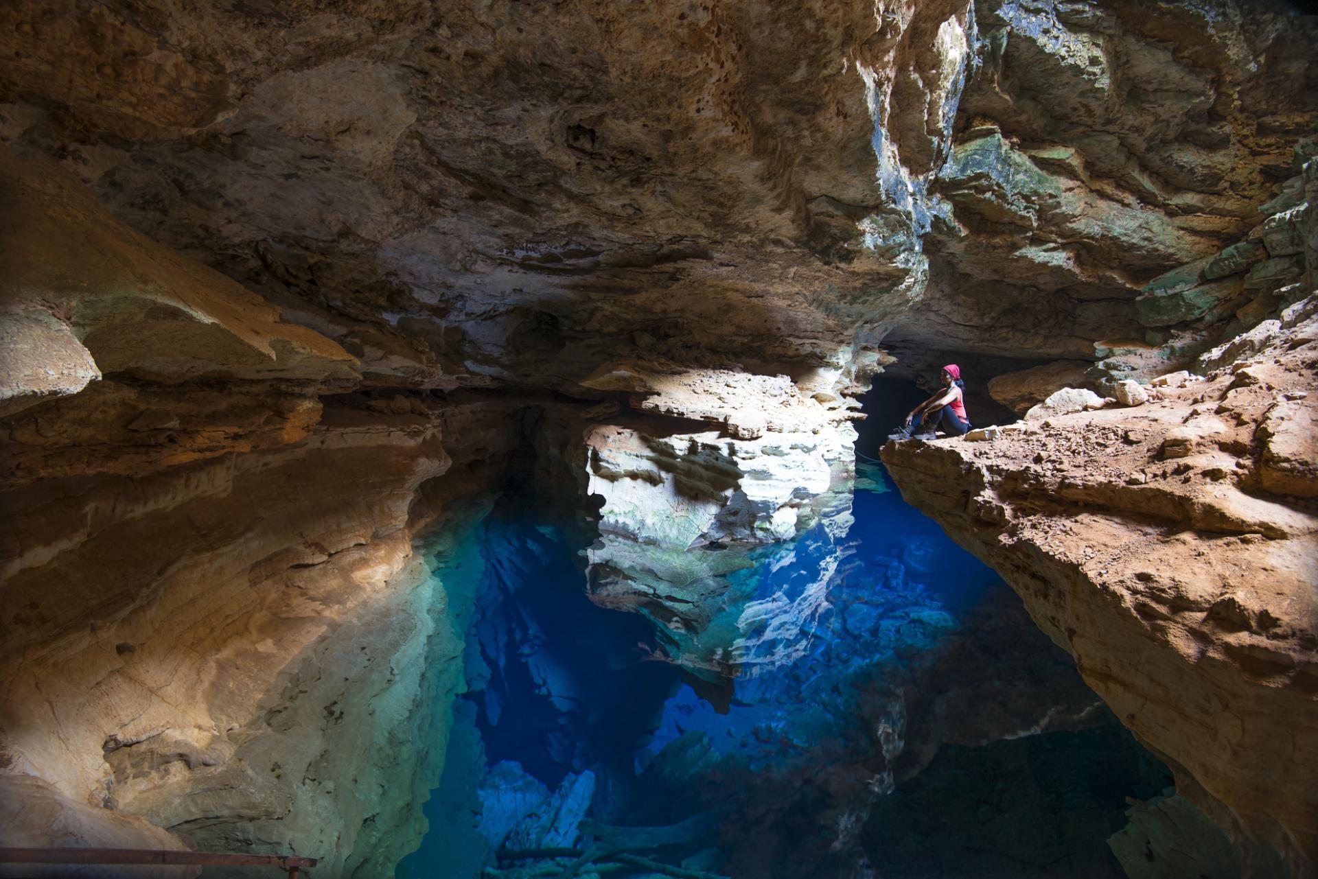 A tourist meditates in a cave in Chapada Diamantina.