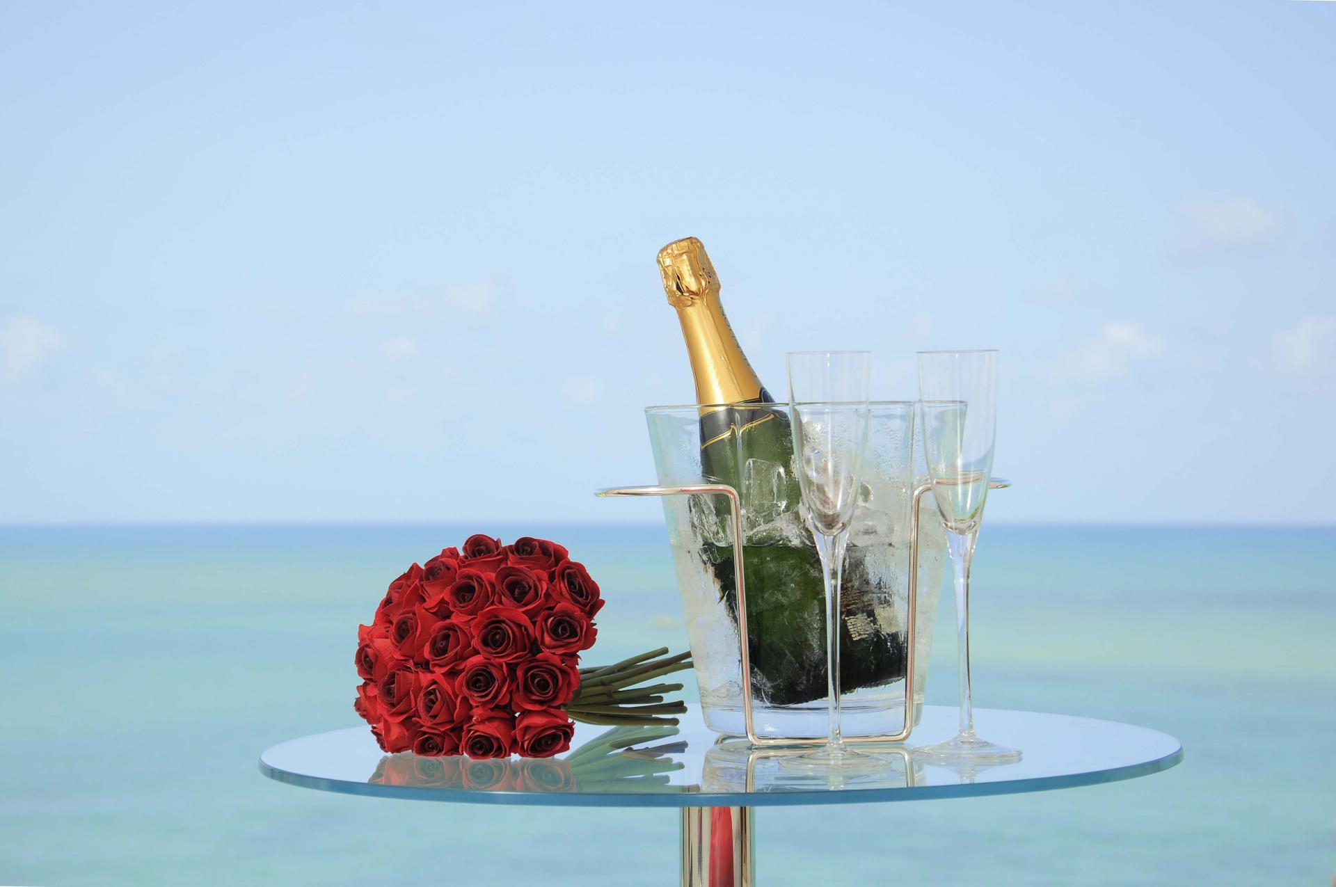 After a wedding in Brazil: Champagne and roses on the beach.