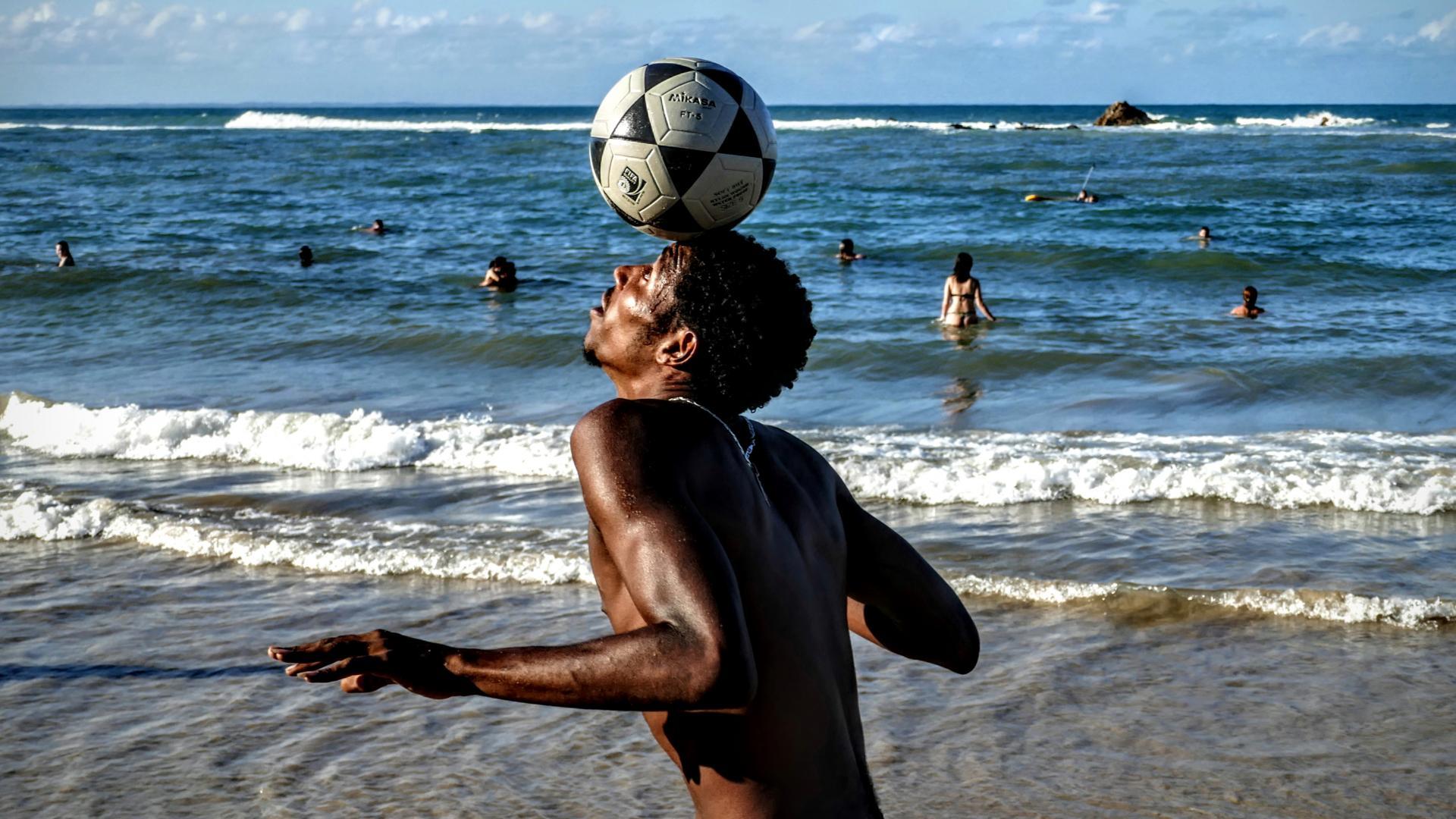 Soccer lovers on the beach in Brazil.