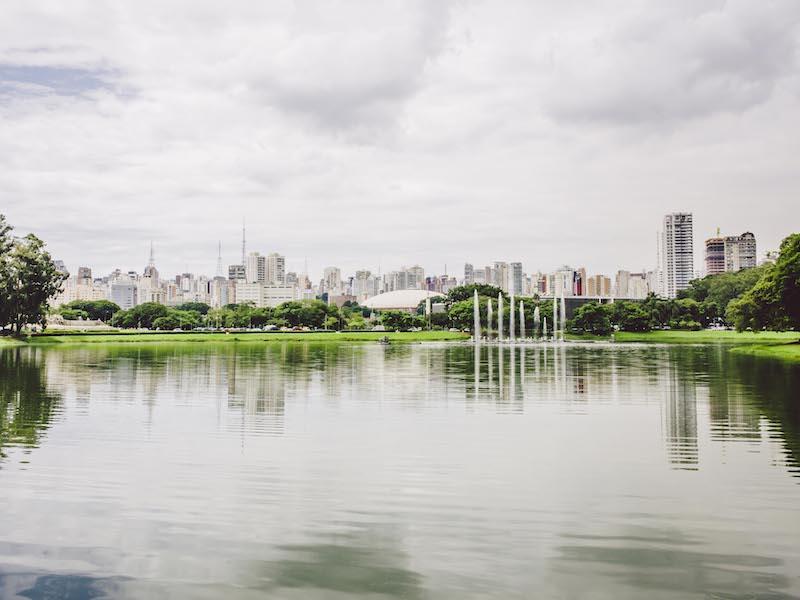 Fountain in the lake of Ibirapuera Park, the skyline of Sao Paulo in the background