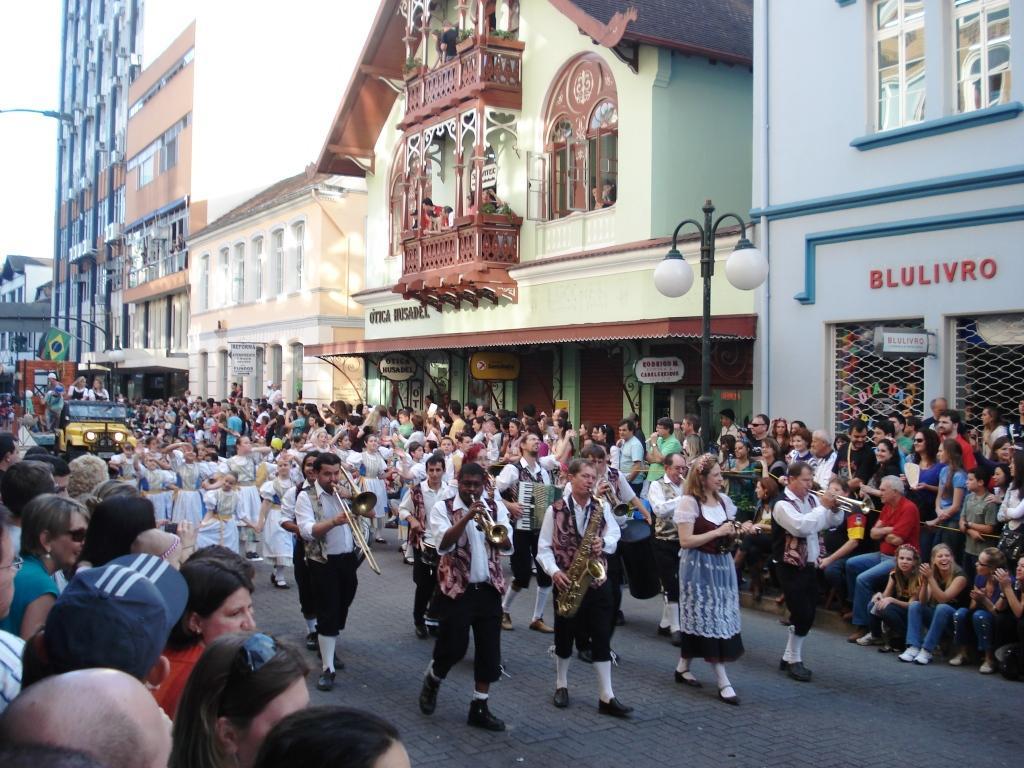 Festive Oktoberfest parade in traditional costumes in Blumenau