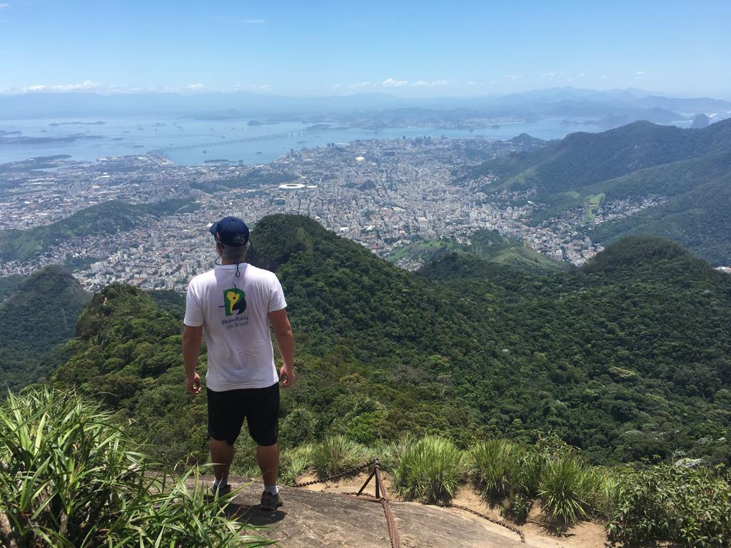 From a hill, a guide from Aventura do Brasil looks over Rio A guide from Aventura do Brasil looks over Rio