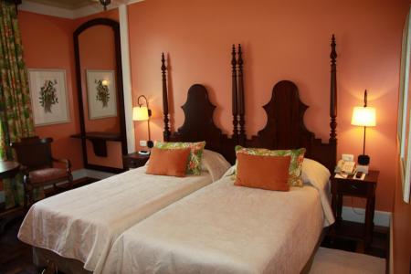 Example of a double room with wooden furniture at Belmond Hotel das Cataratas