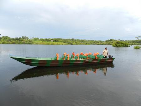 A typical small boat for exucursions near to Amazon Turtle Lodge