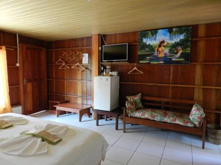Wooden design in a double room at Amazon Turtle Lodge