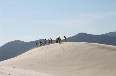 Sandboarding in the dunes of Floripa