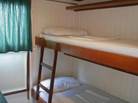 A trunk bed in a cabin of the Amazon Clipper