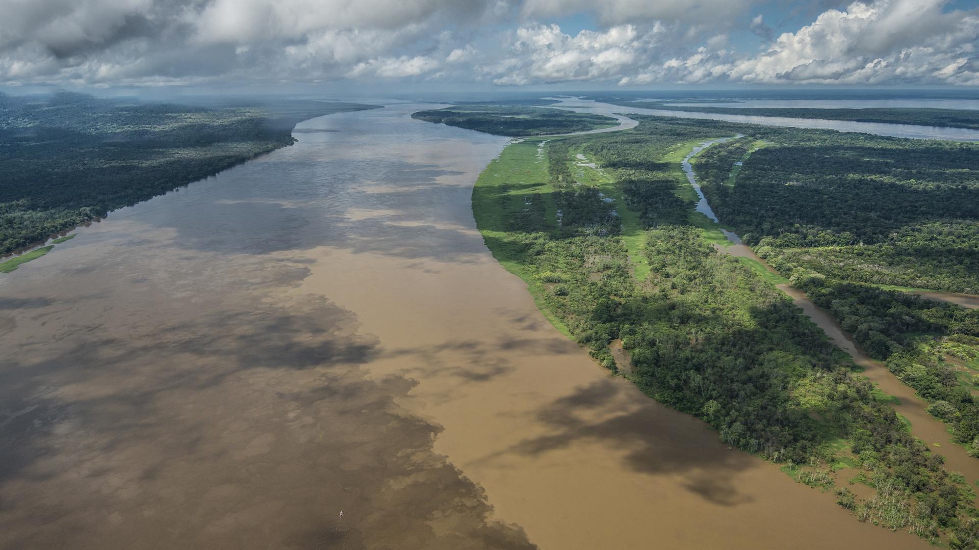 Amazon Boats anchoring at a sandy riverbank