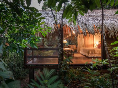 View from outside on a bungalow with hammock at Anavilhanas Jungle Lodge 