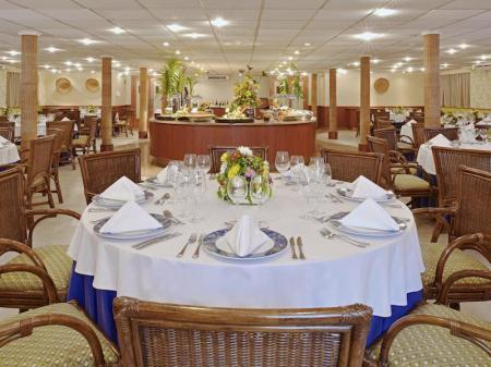 Restaurant with dinning tables on board of Iberostar Grand Amazon