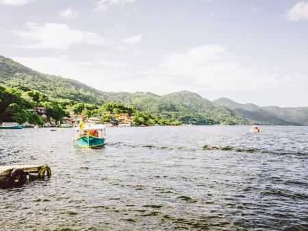 Colorful small boats heading for a day trip around the coast of Florianopolis