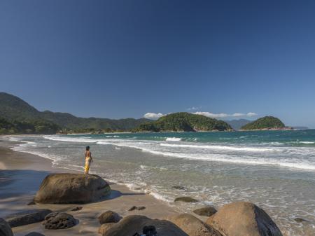 A visitor enjoying the lonely beach near to Paraty