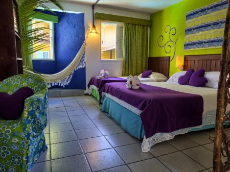 A colorful triple room at Pousada Tabajuba in Porto de Galinhas, Pernambuco - Brazil