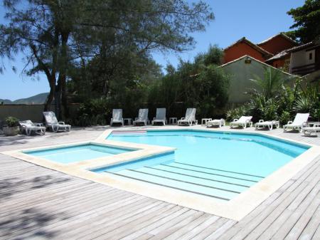 Pool with relaxing area at Pousada dos Gravatas in Buzios, Brazil