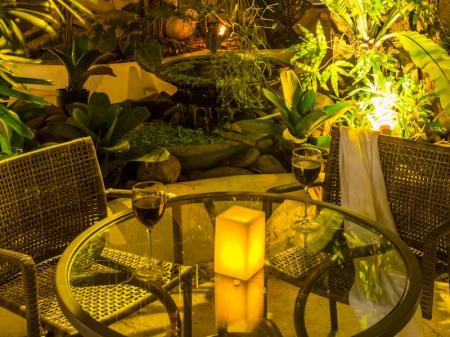 A table with candlelight and wine, perfect for a romantic dinner at Pousada La Chimere in Buzios, Brazil