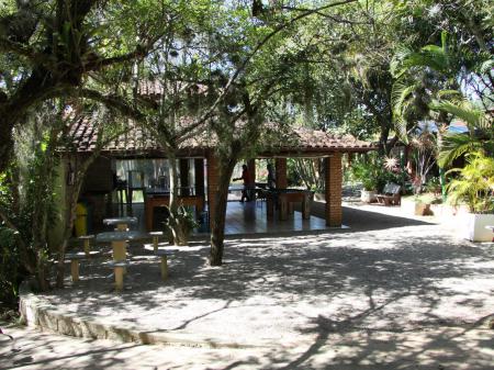 The garden area with lush green and sand at Hotel Sao Sebastiao in Florianopolis - Brazil
