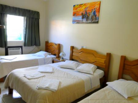 Example of a triple room at Hotel Turismo 
