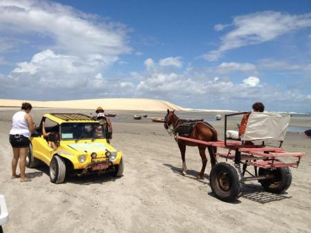 Two visitors during a buggie tour in the dunes, during Rota das Emocoes