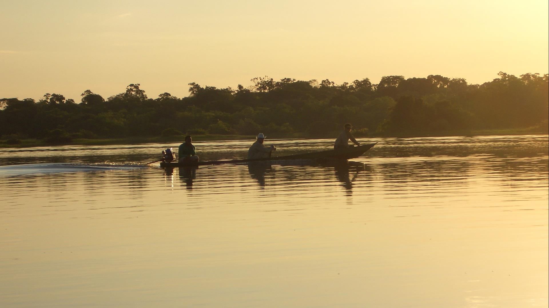 Local fishermen at Sunset in the Amazon Rainforest