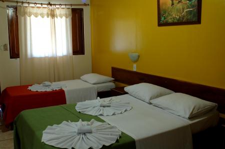 Pousada Piuval - A cozy room with a double bed and a single bed