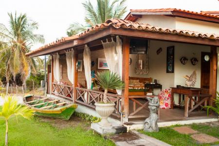 View on the green garden with palm trees of Pousada Jurara