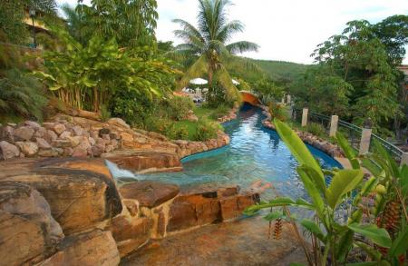 Natural pool with palm trees at Hotel Cantos das Aguas