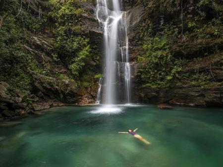 Waterfall fills lagoon for bathing in the Chapada dos Veadeiros