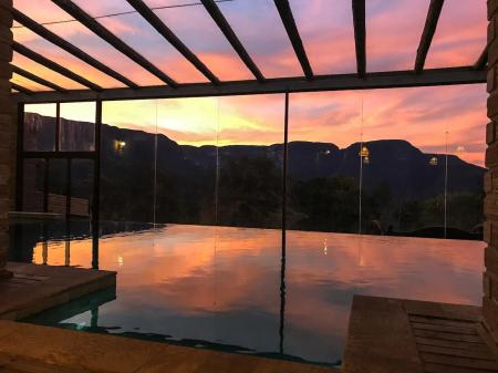 The pool reflecting the sunlight in the late afternoon at Pousada Morada dos Canyons in Santa Catarina