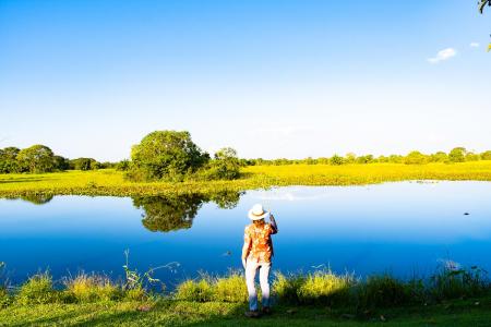 Visitors enjoying the river view at Pousada Aguape