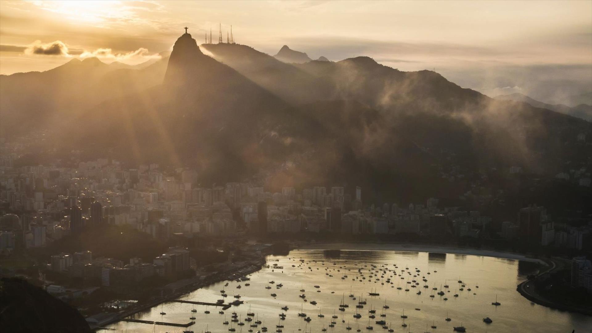 Sunset over Rio, the bay, and Christ the Redeemer