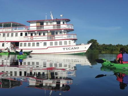 Amazon expedition cruise ship with kayaks in the front