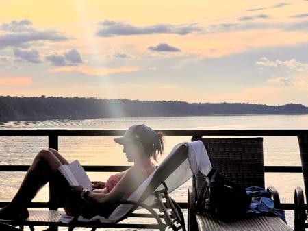 Photo of a woman lying on a deckchair on the deck of the Zaltan